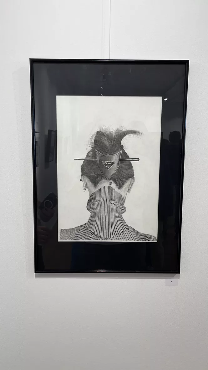 Framed drawing in an exhibition setting